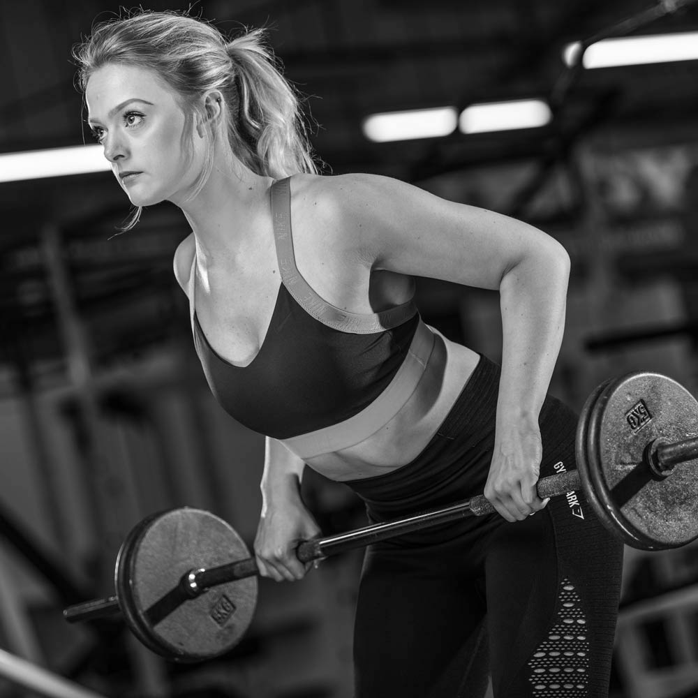 Olivia on a bent-over barbell row, Physical Formula floor