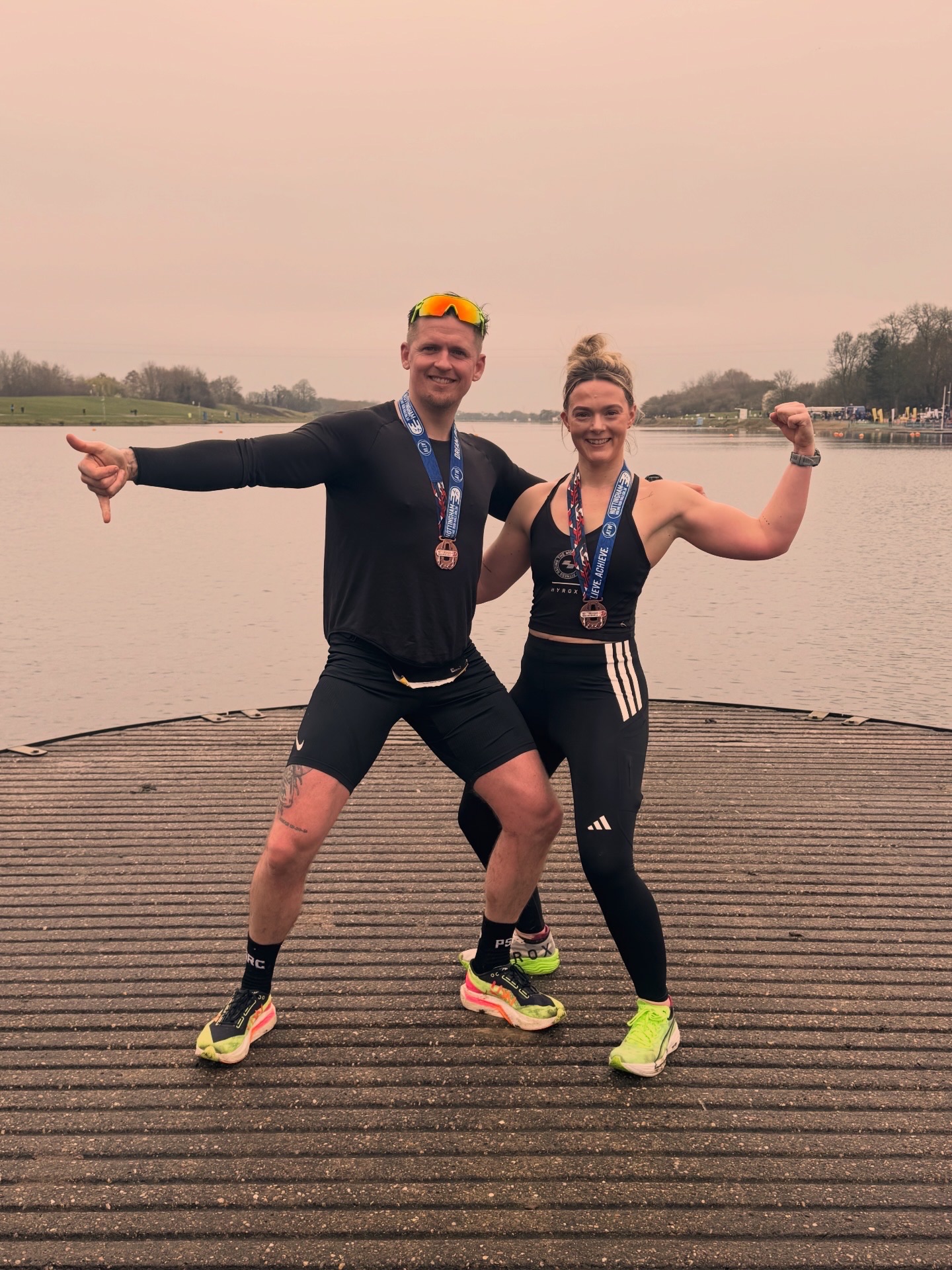 Martin and Olivia with medals after a HYROX race
